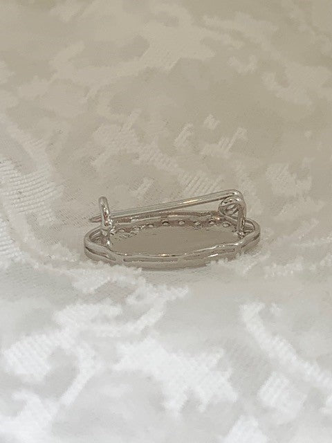Initial white gold brooch