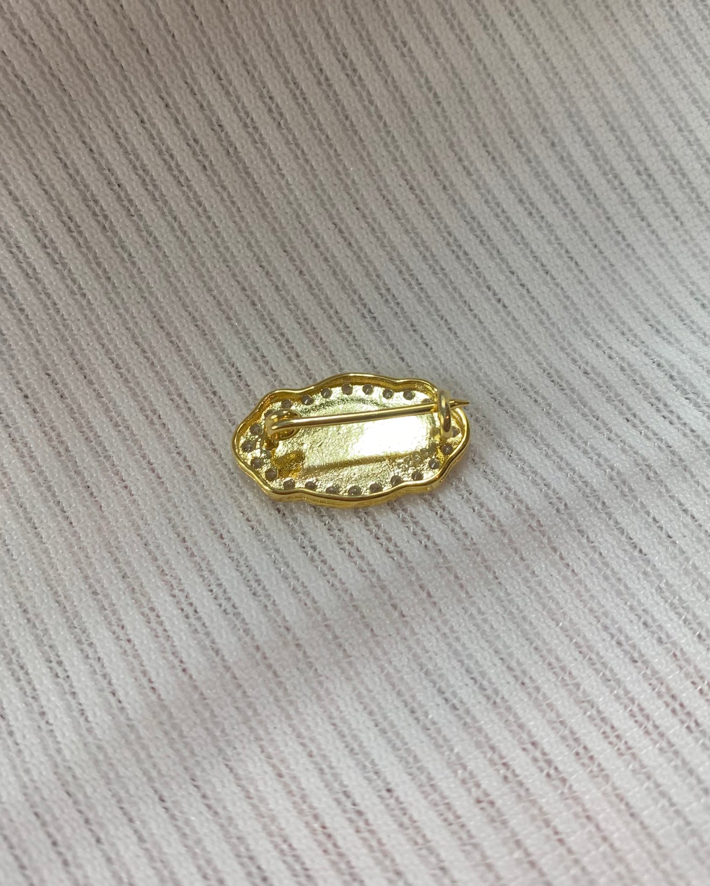 Initial white gold brooch