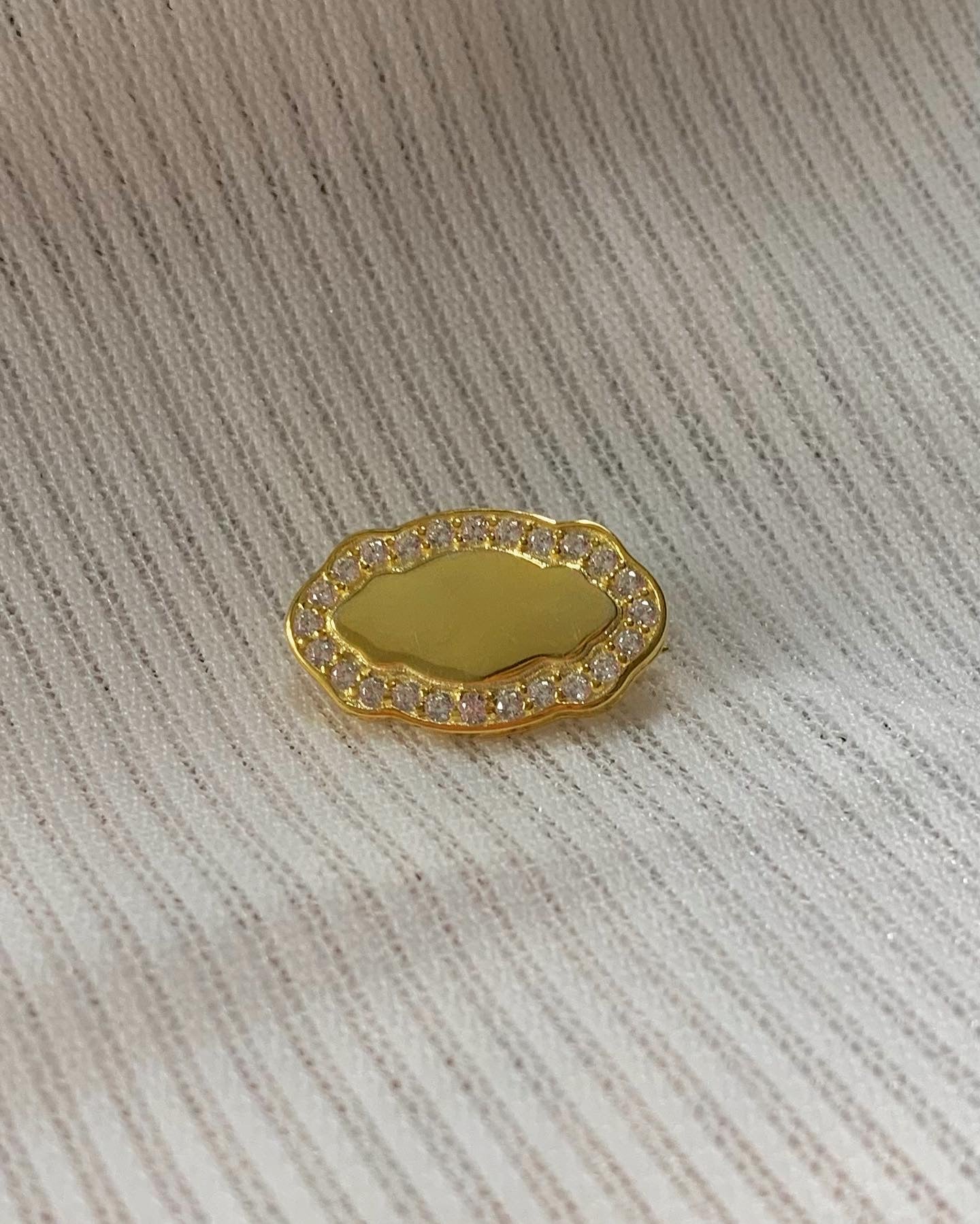 Initial white gold brooch