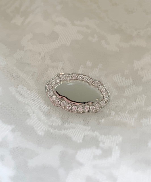 Initial white gold brooch